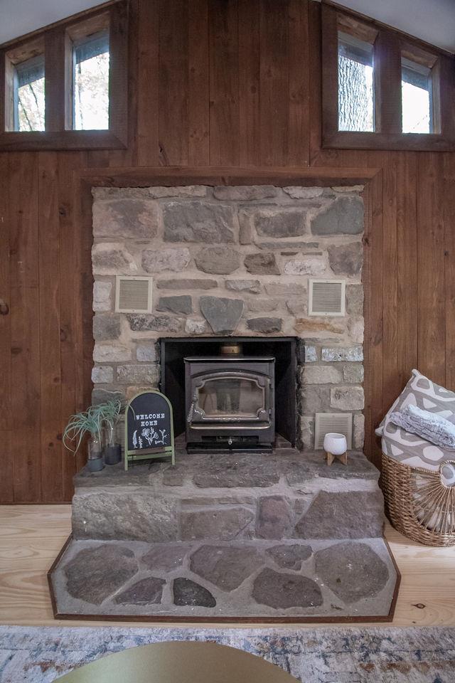 22 Mount Laurel Rd, Greenfield Park, NY 12435 - detailed view of wooden walls, a wood stove, and wood finished floors