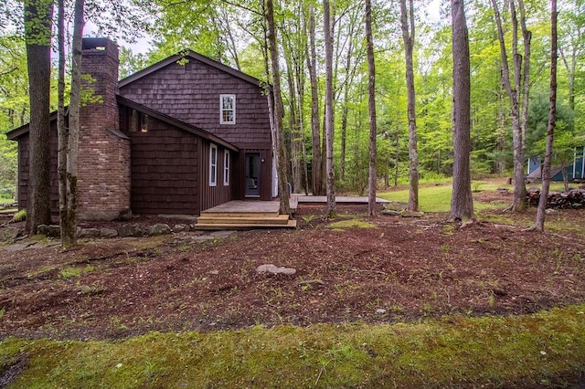 22 Mount Laurel Rd, Greenfield Park, NY 12435 - view of property exterior with a chimney and a wooden deck