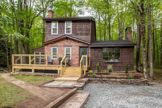 22 Mount Laurel Rd, Greenfield Park, NY 12435 - view of front of property with a chimney, a deck, and brick siding