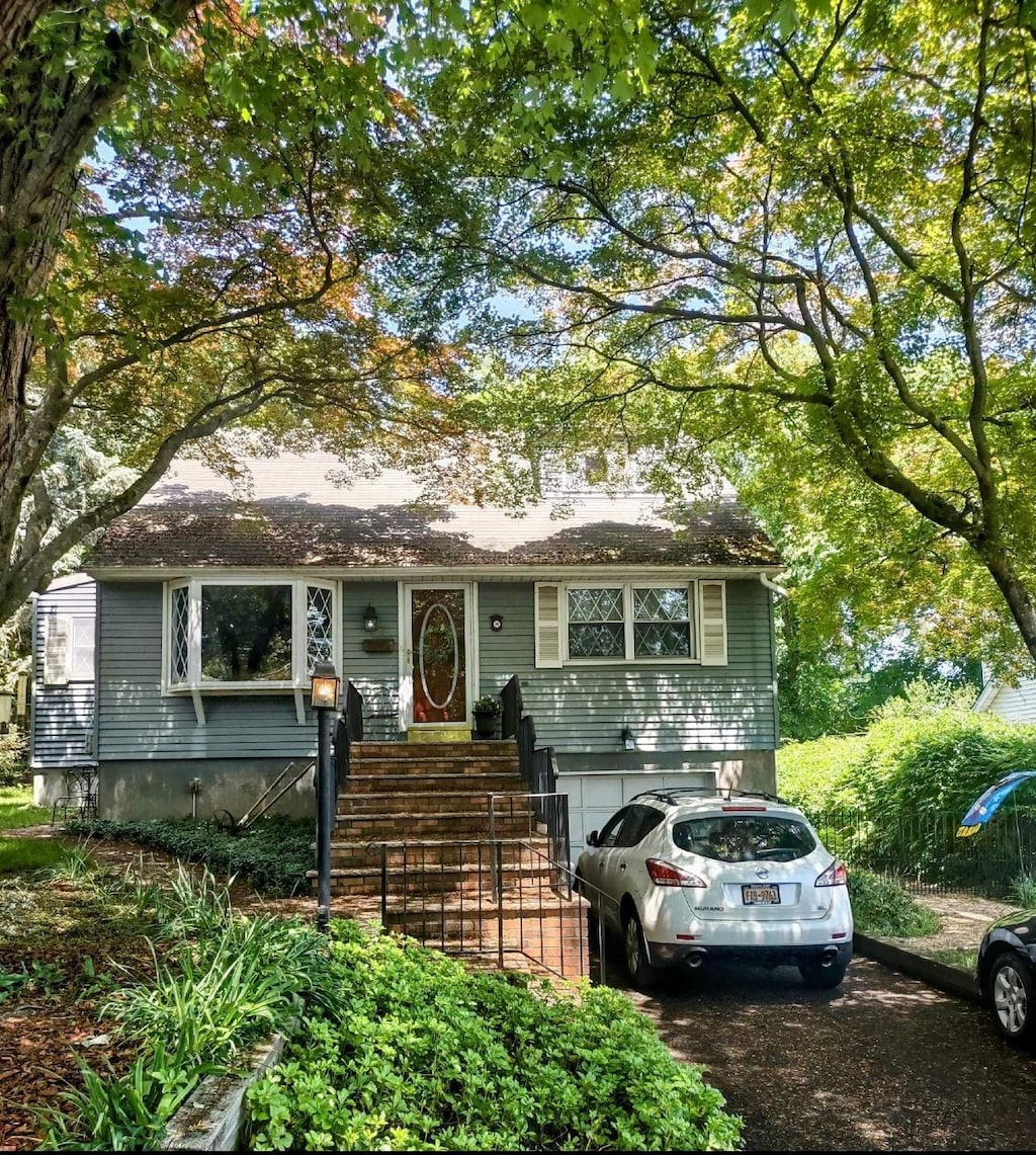 8 Cedar St, Tappan, NY 10983 - view of front of home featuring an attached garage and driveway