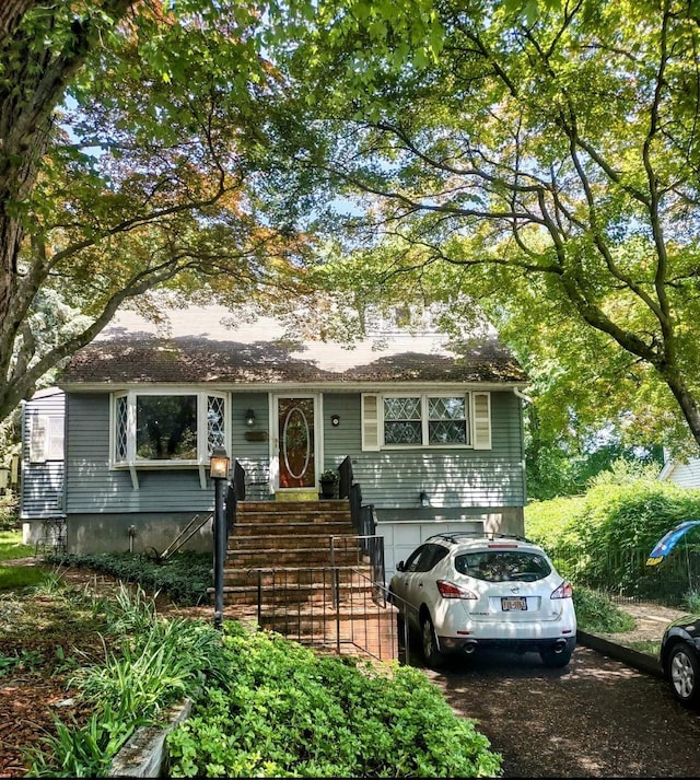 8 Cedar St, Tappan, NY 10983 - view of front of home featuring an attached garage and driveway