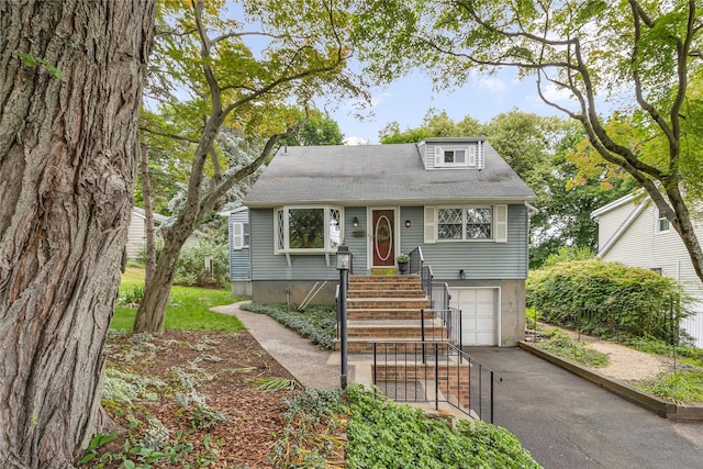 8 Cedar St, Tappan, NY 10983 - view of front of property featuring asphalt driveway and an attached garage