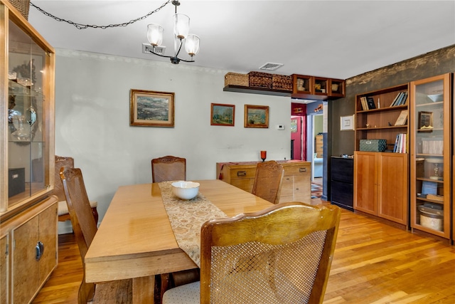 8 Cedar St, Tappan, NY 10983 - dining space with light wood-style flooring and a chandelier