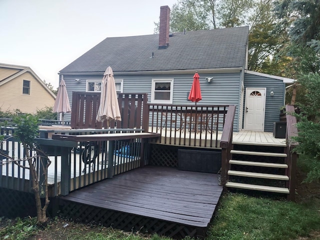 8 Cedar St, Tappan, NY 10983 - rear view of property with a chimney and a wooden deck