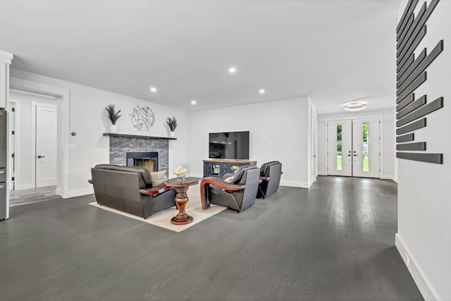 15 Somers Hills Rd, Carmel, NY 10512 - living room featuring baseboards, dark wood-type flooring, a fireplace, recessed lighting, and french doors