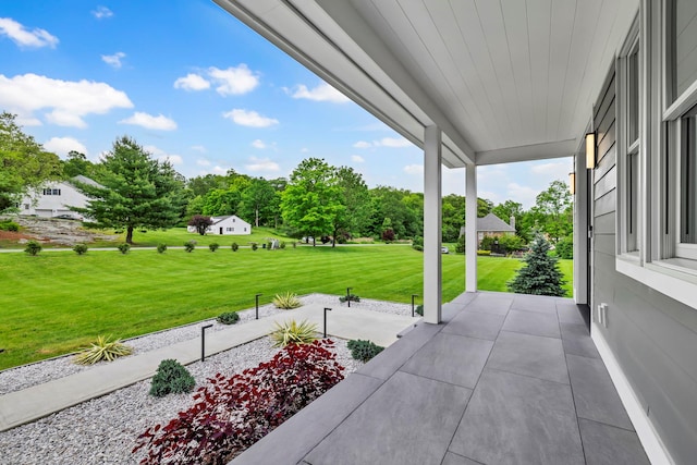 15 Somers Hills Rd, Carmel, NY 10512 - covered porch featuring a lawn and view of scattered trees