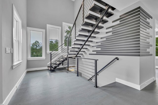 15 Somers Hills Rd, Carmel, NY 10512 - staircase with baseboards, plenty of natural light, wood finished floors, and a high ceiling