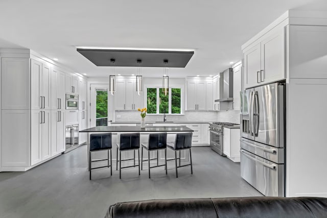 15 Somers Hills Rd, Carmel, NY 10512 - kitchen with appliances with stainless steel finishes, wall chimney exhaust hood, decorative backsplash, a breakfast bar, and white cabinetry