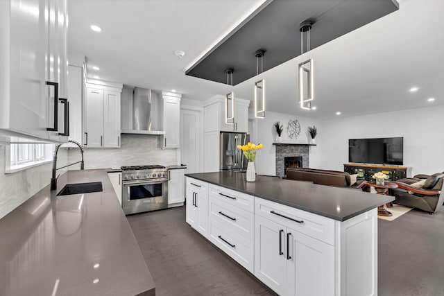15 Somers Hills Rd, Carmel, NY 10512 - kitchen featuring wall chimney range hood, stainless steel appliances, a sink, decorative backsplash, and dark countertops
