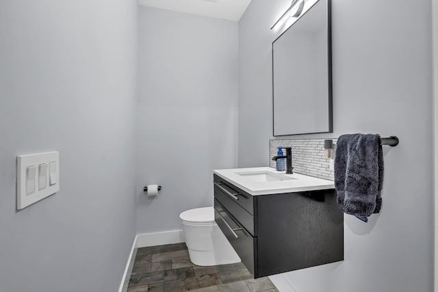 15 Somers Hills Rd, Carmel, NY 10512 - bathroom featuring vanity, toilet, baseboards, backsplash, and wood finished floors