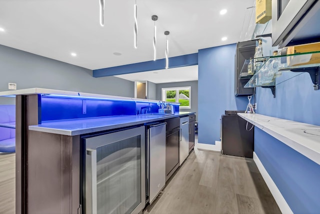 15 Somers Hills Rd, Carmel, NY 10512 - kitchen featuring beverage cooler, light wood-type flooring, modern cabinets, baseboards, and recessed lighting