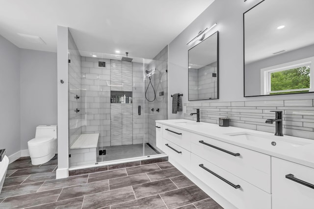 15 Somers Hills Rd, Carmel, NY 10512 - bathroom with double vanity, toilet, a shower stall, recessed lighting, and backsplash