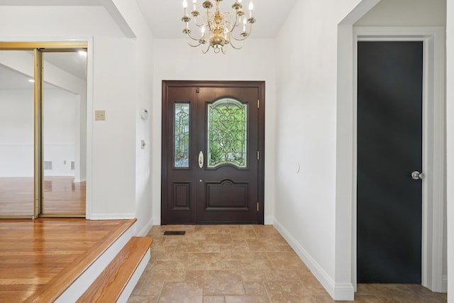 2 Sagamore Ave, Suffern, NY 10901 - foyer entrance featuring stone finish floors and a chandelier