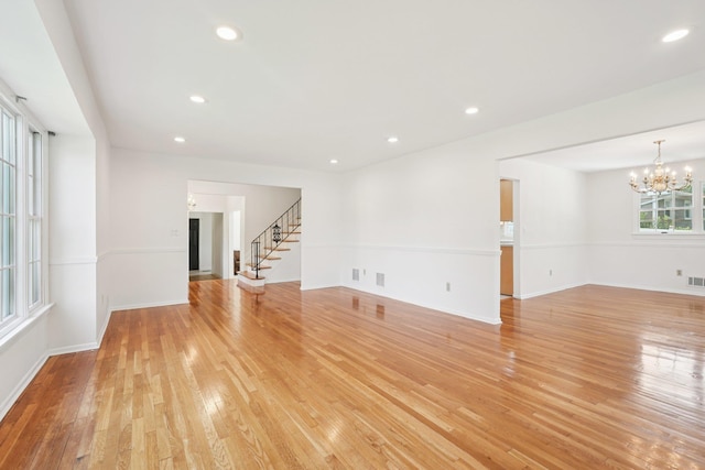 2 Sagamore Ave, Suffern, NY 10901 - empty room featuring stairs, a chandelier, light wood-type flooring, and recessed lighting