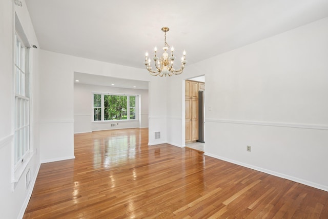 2 Sagamore Ave, Suffern, NY 10901 - empty room with a chandelier, light wood-type flooring, and recessed lighting