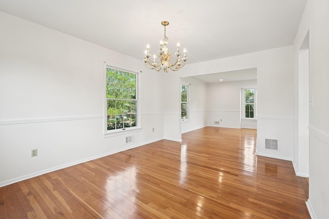 2 Sagamore Ave, Suffern, NY 10901 - empty room featuring a chandelier and wood finished floors