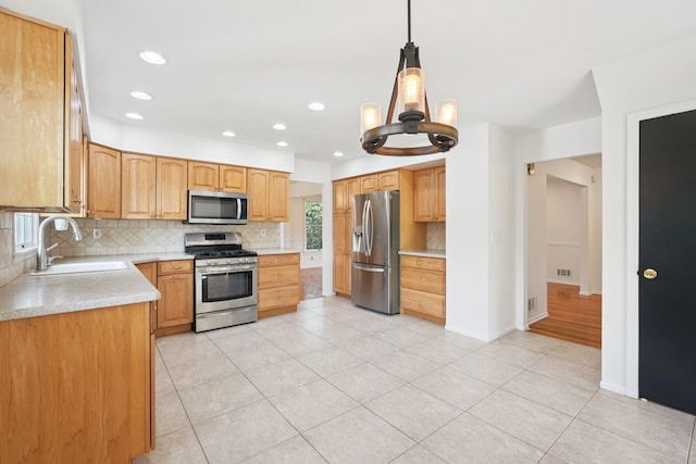2 Sagamore Ave, Suffern, NY 10901 - kitchen with appliances with stainless steel finishes, backsplash, a chandelier, light tile patterned floors, and recessed lighting