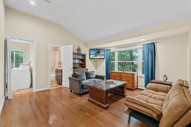 22 Claremont Trl, Monroe, NY 10950 - living area featuring light wood-type flooring, healthy amount of natural light, vaulted ceiling, recessed lighting, and a baseboard radiator
