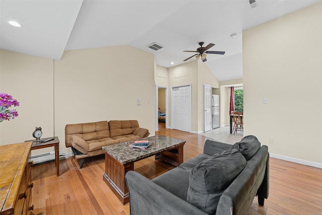 22 Claremont Trl, Monroe, NY 10950 - living room with vaulted ceiling, a baseboard heating unit, ceiling fan, light wood finished floors, and baseboards