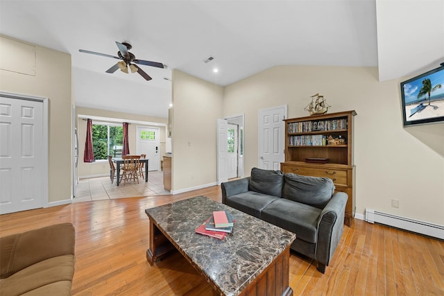 22 Claremont Trl, Monroe, NY 10950 - living area with a ceiling fan, vaulted ceiling, light wood-style floors, a baseboard heating unit, and baseboards