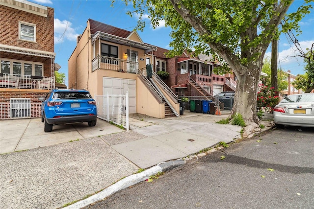 987 Pierce Ave, Bronx, NY 10462 - townhome / multi-family property with stairway and stucco siding