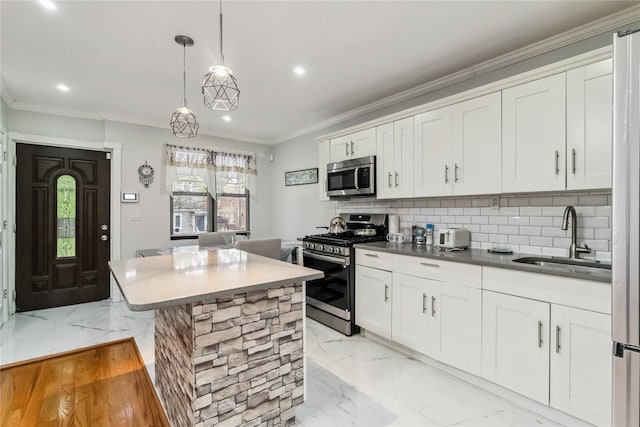 987 Pierce Ave, Bronx, NY 10462 - kitchen featuring stainless steel appliances, a sink, recessed lighting, light marble finish floors, and backsplash