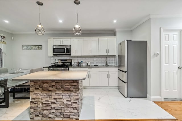 987 Pierce Ave, Bronx, NY 10462 - kitchen with appliances with stainless steel finishes, a sink, ornamental molding, white cabinets, and tasteful backsplash