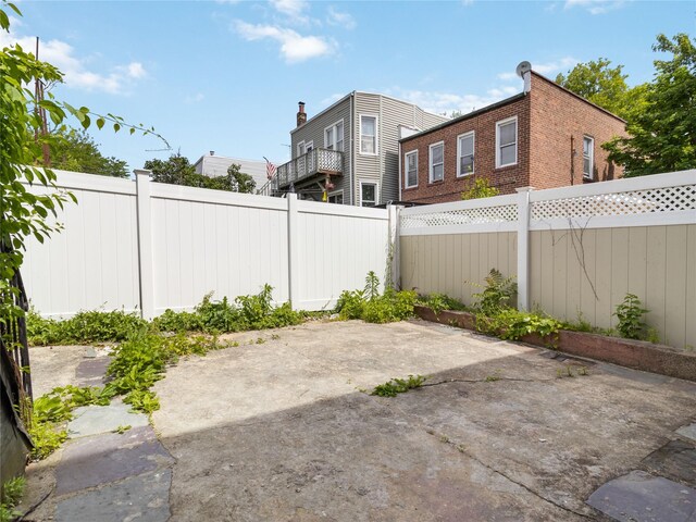 987 Pierce Ave, Bronx, NY 10462 - fenced backyard with a patio
