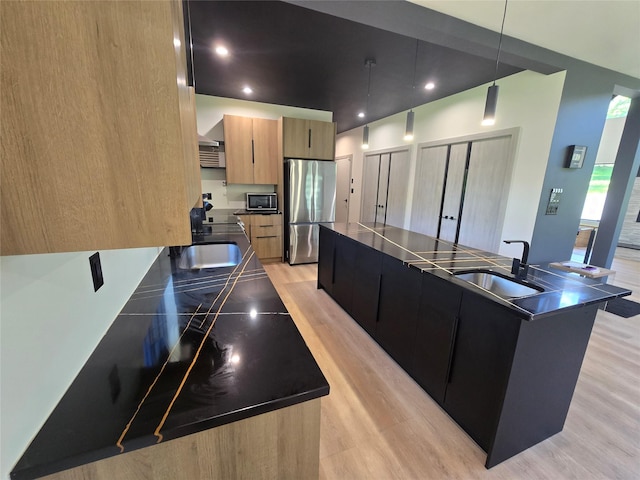 30 Coleman Dr, Campbell Hall, NY 10916 - kitchen featuring appliances with stainless steel finishes, dark countertops, a sink, light wood-style floors, and recessed lighting
