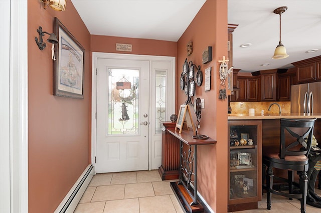 1 Angelica Ct, West Babylon, NY 11704 - entryway featuring a baseboard heating unit, light tile patterned floors, and baseboards