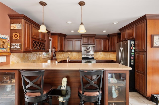 1 Angelica Ct, West Babylon, NY 11704 - kitchen with appliances with stainless steel finishes, a peninsula, light countertops, a breakfast bar, and recessed lighting