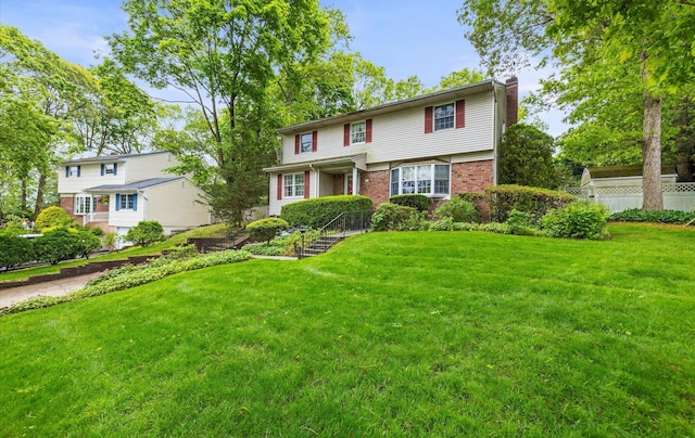 9 Gull Dr, Hauppauge, NY 11788 - view of front of home featuring a chimney and brick siding