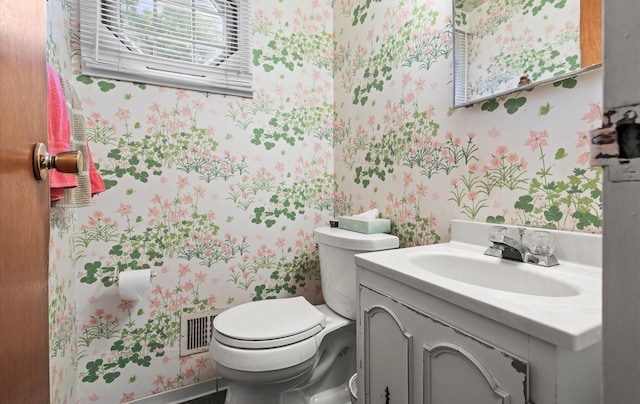 9 Gull Dr, Hauppauge, NY 11788 - half bathroom featuring wallpapered walls, toilet, and vanity
