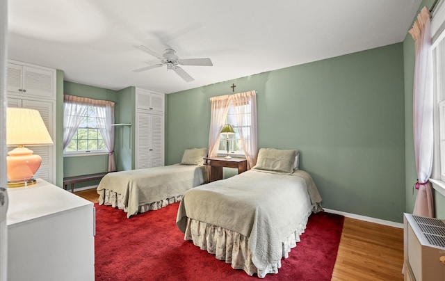 9 Gull Dr, Hauppauge, NY 11788 - bedroom featuring baseboards, wood finished floors, ceiling fan, and a closet