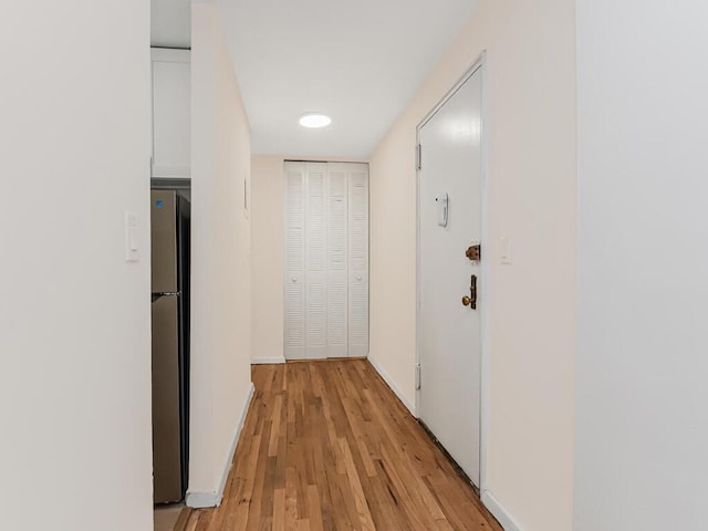 3311 Giles Pl Unit 5H, Bronx, NY 10463 - hallway featuring light wood finished floors and baseboards