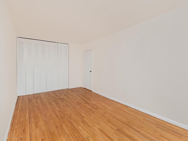 3311 Giles Pl Unit 5H, Bronx, NY 10463 - unfurnished bedroom featuring light wood-style floors, a closet, and baseboards