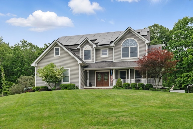 7 Gabriels Dr, Chester, NY 10918 - view of front of home featuring a porch, a front lawn, and roof mounted solar panels