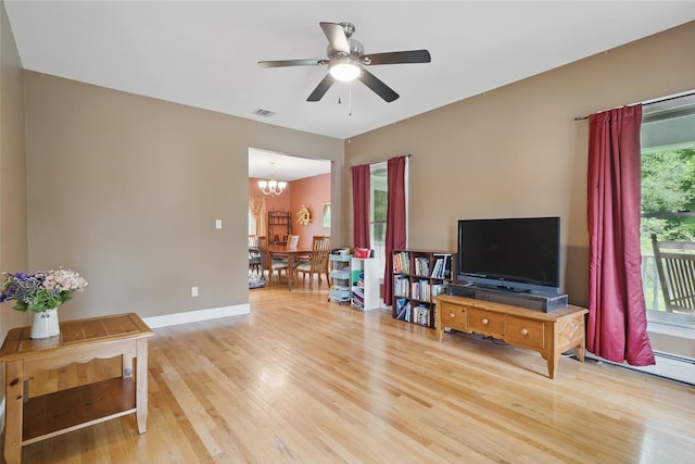 7 Gabriels Dr, Chester, NY 10918 - living room featuring a chandelier, light wood-type flooring, a ceiling fan, and baseboards