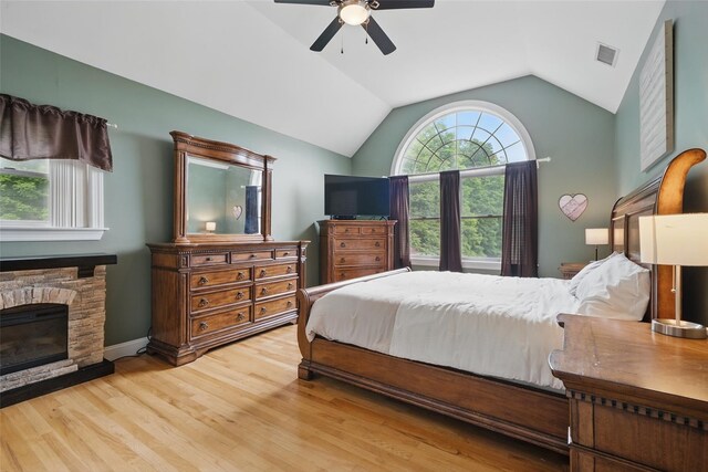7 Gabriels Dr, Chester, NY 10918 - bedroom featuring wood finished floors, lofted ceiling, a fireplace, and ceiling fan