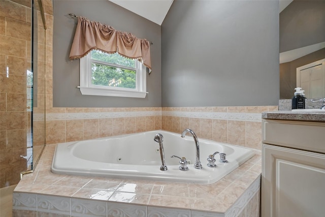 7 Gabriels Dr, Chester, NY 10918 - bathroom featuring a jetted tub, vanity, and vaulted ceiling