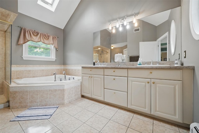 7 Gabriels Dr, Chester, NY 10918 - full bathroom with a skylight, double vanity, a stall shower, high vaulted ceiling, and a garden tub