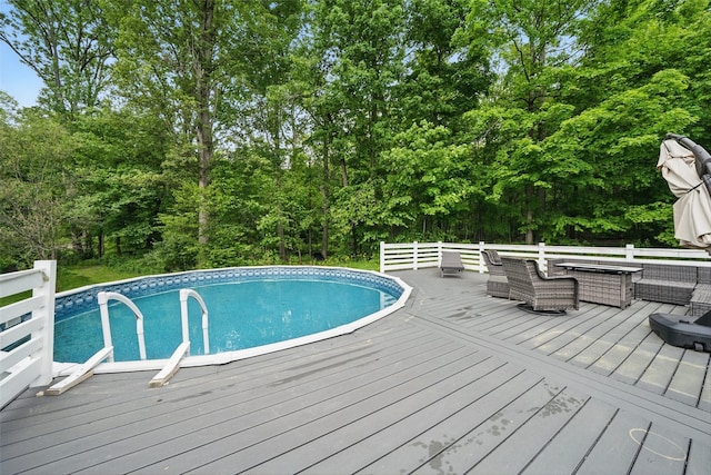 7 Gabriels Dr, Chester, NY 10918 - outdoor pool featuring a wooden deck, outdoor lounge area, and view of wooded area