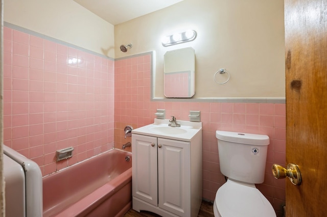 1149 E 219th St, Bronx, NY 10469 - full bath with vanity, tub / shower combination, tile walls, and wainscoting
