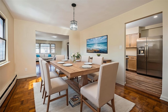 1149 E 219th St, Bronx, NY 10469 - dining area with a baseboard radiator and baseboards