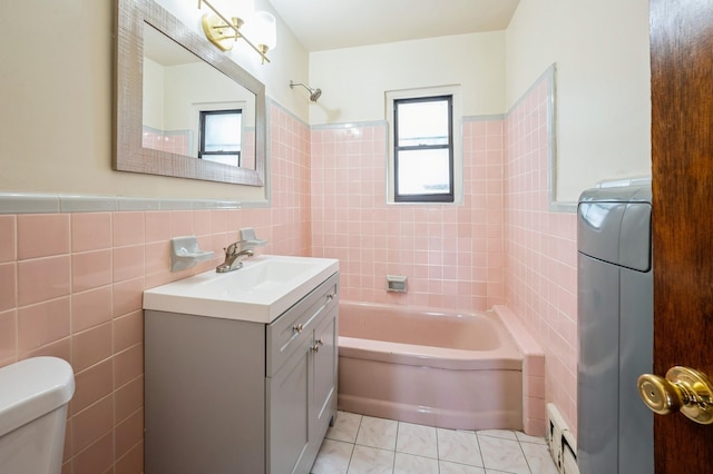 1149 E 219th St, Bronx, NY 10469 - bathroom with tile walls, vanity, and  shower combination