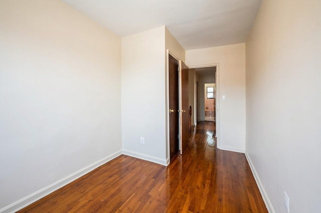 1149 E 219th St, Bronx, NY 10469 - unfurnished room featuring wood finished floors and baseboards