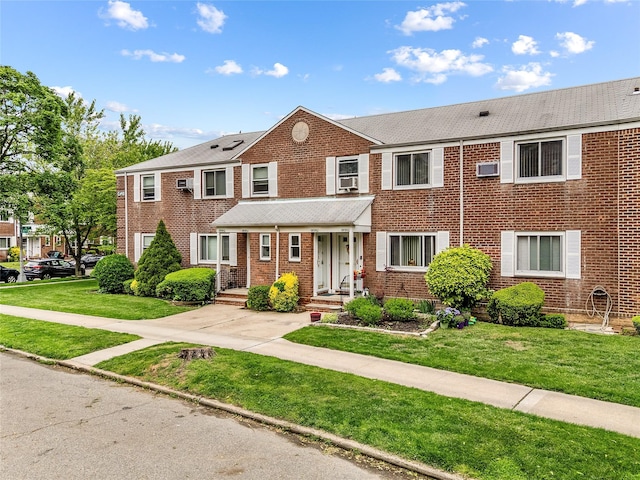 247-78 77th Cres Unit B, Bellerose, NY 11426 - townhome / multi-family property featuring brick siding and a front lawn