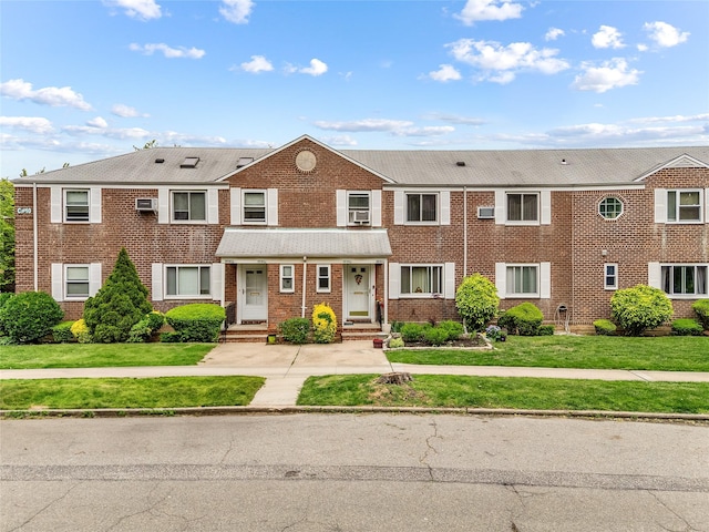 247-78 77th Cres Unit B, Bellerose, NY 11426 - townhome / multi-family property with brick siding and a front lawn