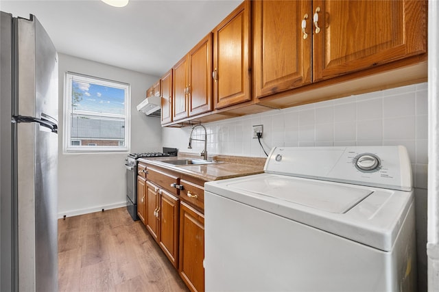 247-78 77th Cres Unit B, Bellerose, NY 11426 - laundry room with washer / dryer, light wood-type flooring, and baseboards