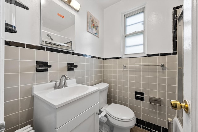 247-78 77th Cres Unit B, Bellerose, NY 11426 - full bath featuring tile walls, toilet, vanity, a shower, and a wainscoted wall